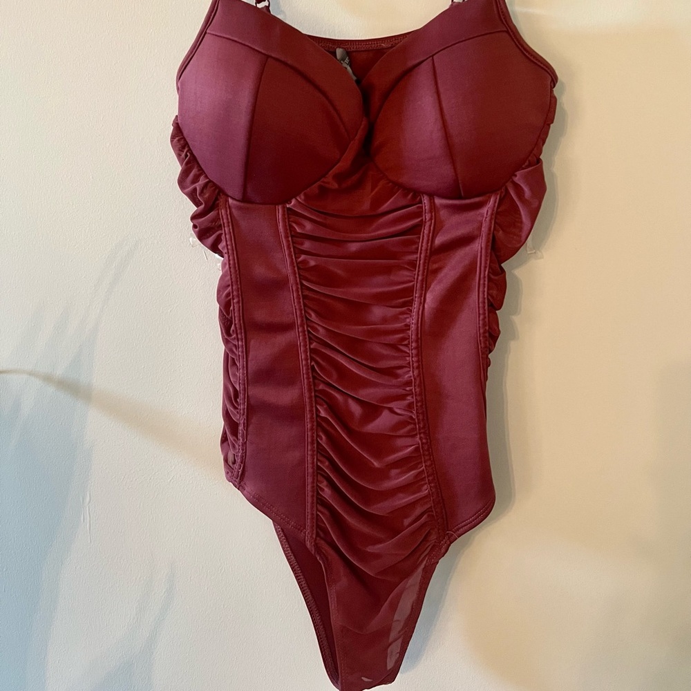 Mauve berry runched bodysuit. Button enclosure. Adjustable straps